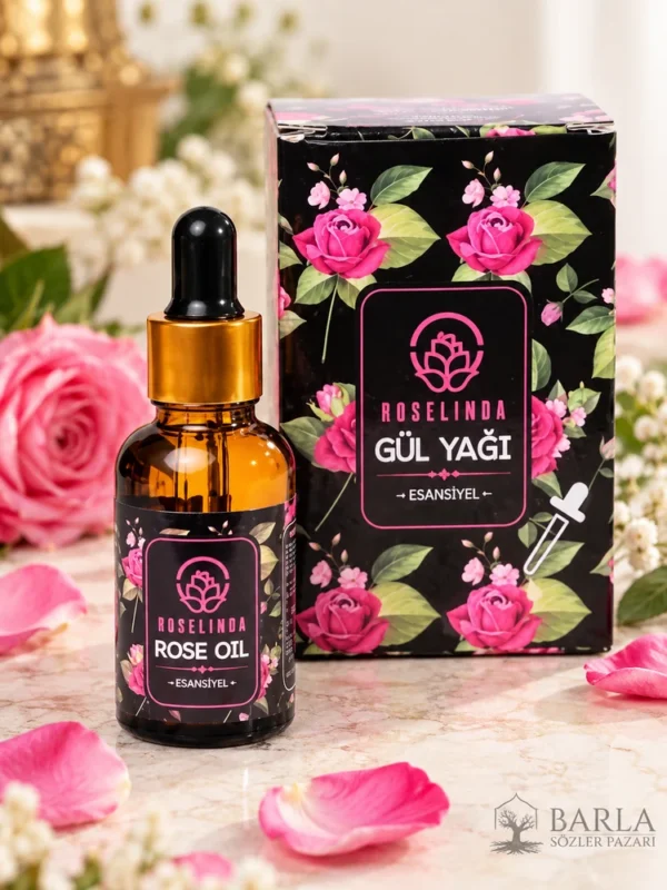 Roselinda Esansiyel Gül Yağı 30 ml siyah güllü kutu ve amber şişe